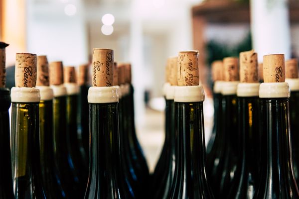 Elegant rare vintage red wine bottle on dark background